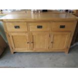 A modern oak sideboard, 150cm wide x 90cm high