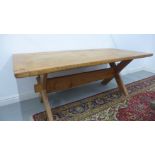 A large pine kitchen/dining table with cleated ends and X frame supports, top 190x90cm, height