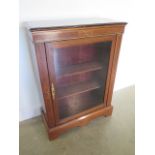 A Victorian inlaid walnut pier cabinet with a single glazed door, 104cm tall x 76cm x 30cm