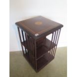 A mahogany inlaid revolving bookcase, 85cm tall x 46cm x 46cm