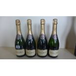Four bottles of Graham Beck Champagne