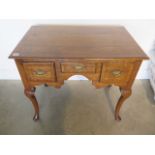 An oak three drawer lowboy on shaped legs, 73cm tall x 83cm x 53cm