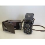 A Rolleicord twin lens camera by Franke and Heidecke with leather case, shutter working