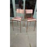 A pair of modern copper bar stools