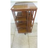 An early 20th century oak revolving bookcase, 112cm tall x 56cm x 55cm