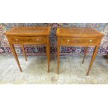 A pair of walnut bow fronted lamp tables, each with a frieze drawer on square tapering legs, 77cm