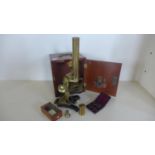A nice quality brass microscope, 33cm tall, in fitted mahogany case