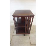 An early 20th century mahogany revolving bookcase, 80cm tall x 47cm x 46cm