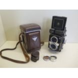 A Yashica - LM Twin lens camera MTL 2060752 - with leather case and No 2 close up attachments,