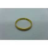 A hallmarked 22ct band ring, size P, approx 2.4 grams, some usage marks but generally good