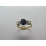 An 18ct hallmarked gold sapphire and diamond ring, diamond weight approx .55pts, VS2 - sapphire