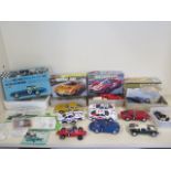 A collection of eight kit racing cars, some with electric track motors, and assorted kits and part