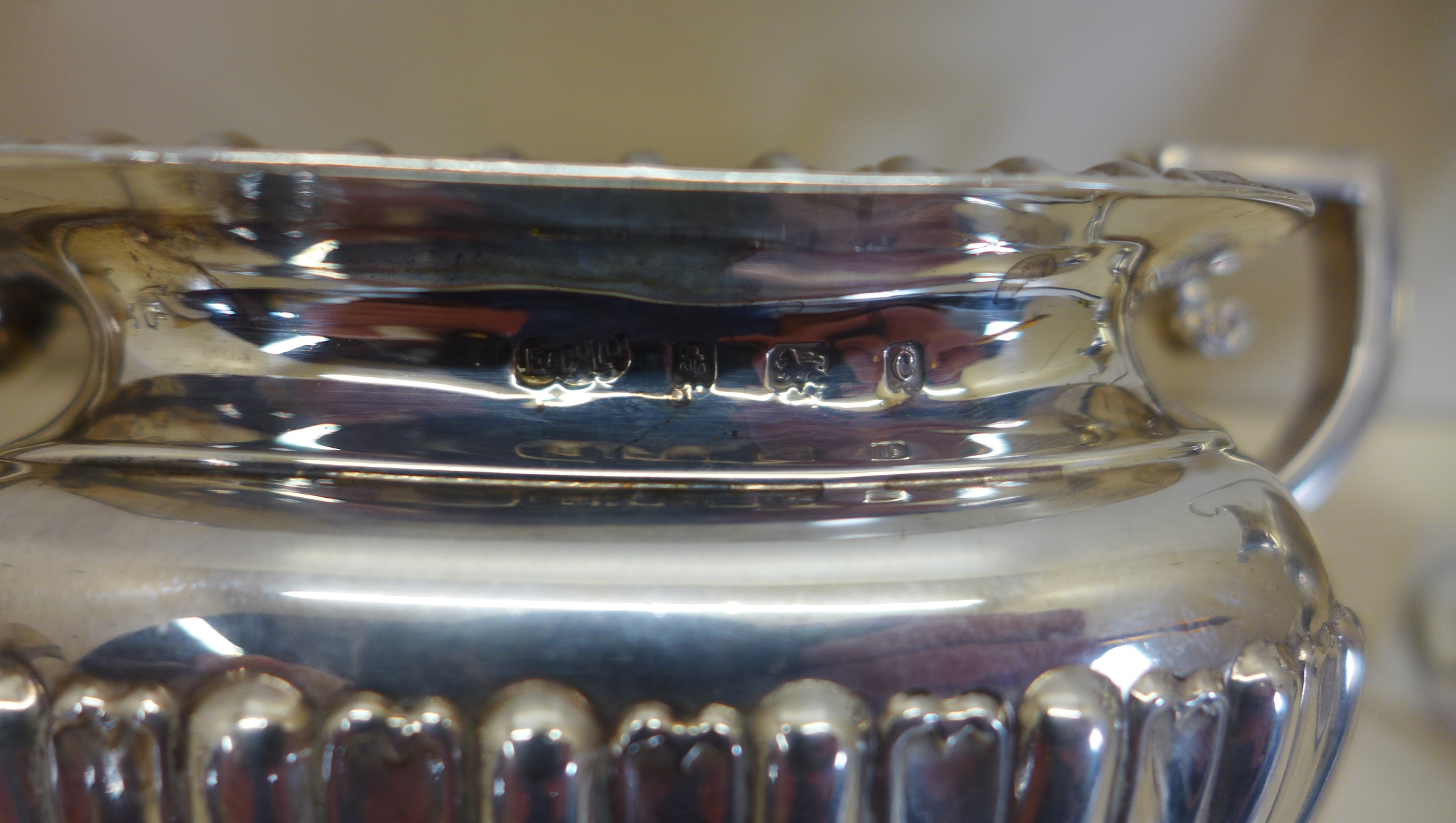 A silver twin handled sugar bowl, Birmingham 1902 - a silver cream jug Chester 1906 - and a silver - Image 3 of 5