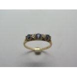 An 18ct hallmarked yellow gold sapphire and diamond half hoop ring, diamond weight approx 0.20pts,