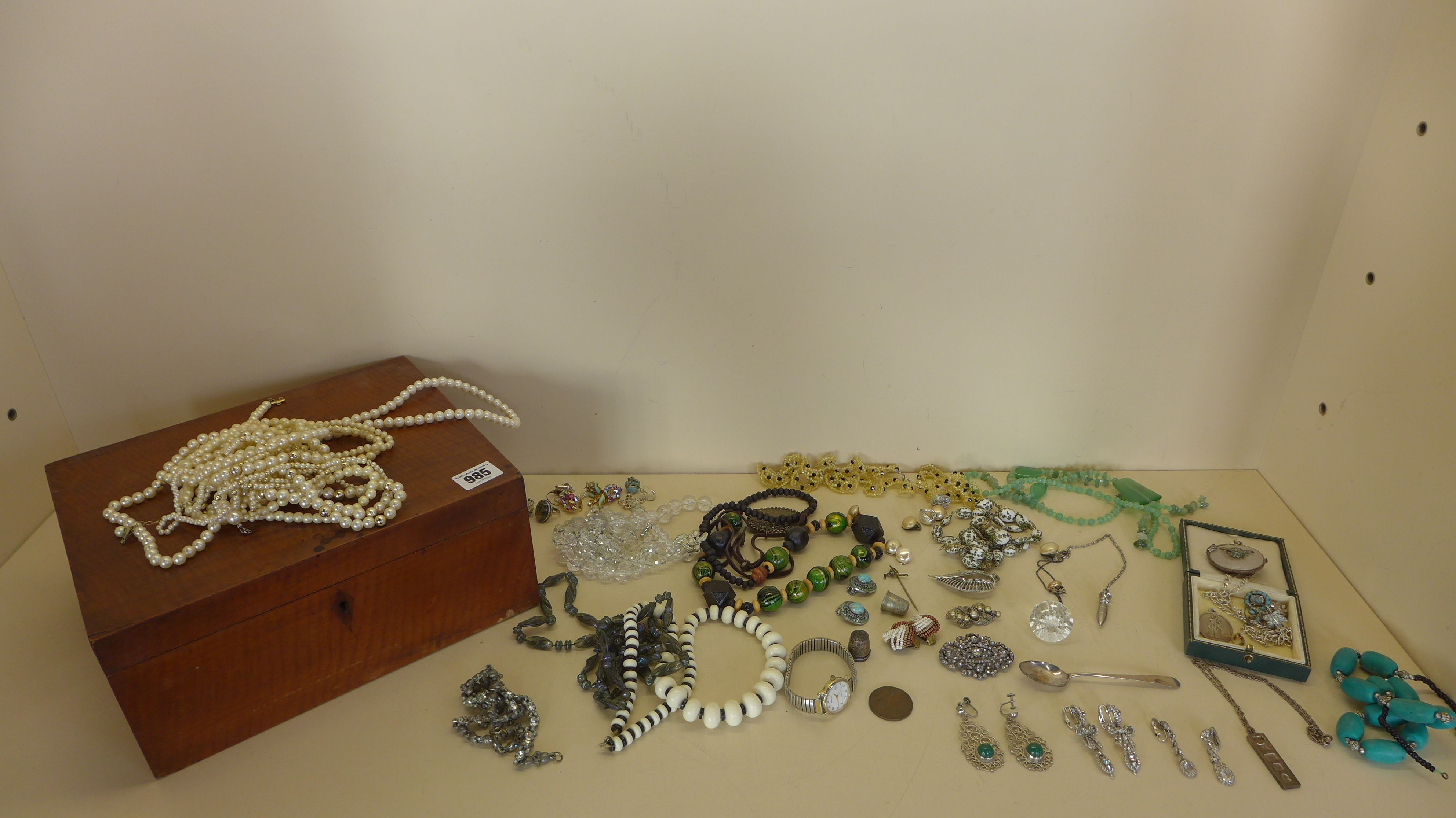 A collection of assorted costume and other jewellery including some silver in a satin wood box