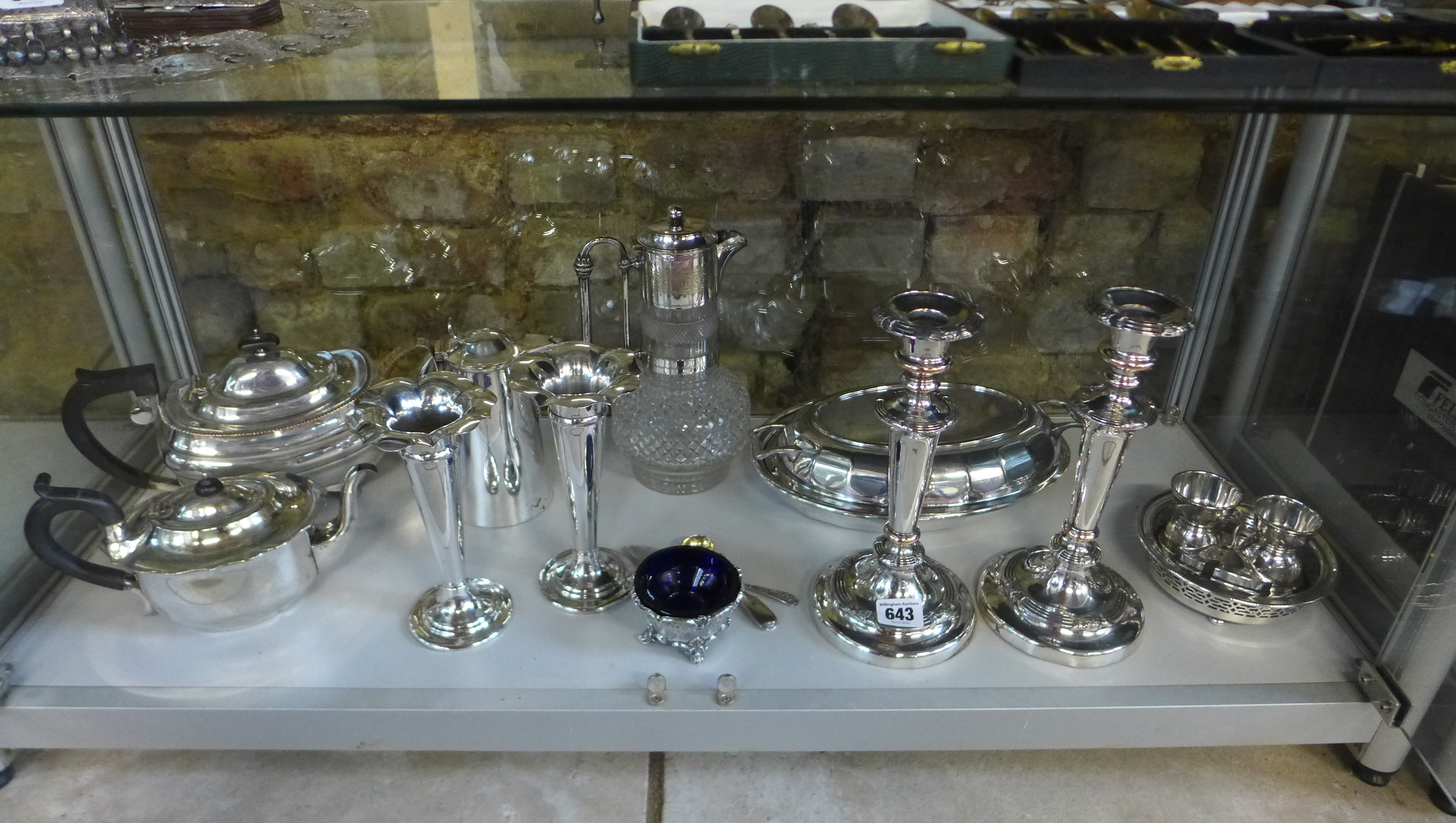 A collection of silver plated ware including pair for candlesticks, vases, claret jug etc, generally