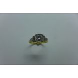 An 18ct and platinum diamond ring, the central stone approx 0.45ct, ring size N/O, approx 3.7 grams,