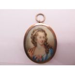 An antique gold portrait locket, probably late Georgian/early Victorian with a watercolour on