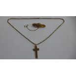 A 9ct yellow gold diamond brooch and a crucifix on chain, both test to approx 9ct, total weight