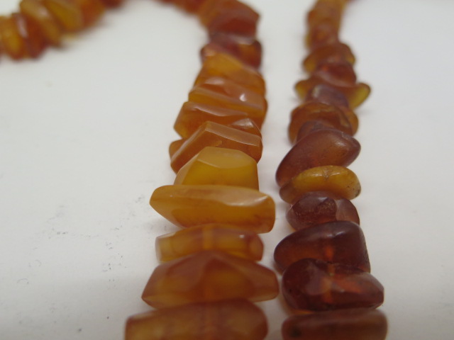 Two strings of deep honey colour un-cut polished amber beads, total weight approx 168 grams, lengths - Image 4 of 4