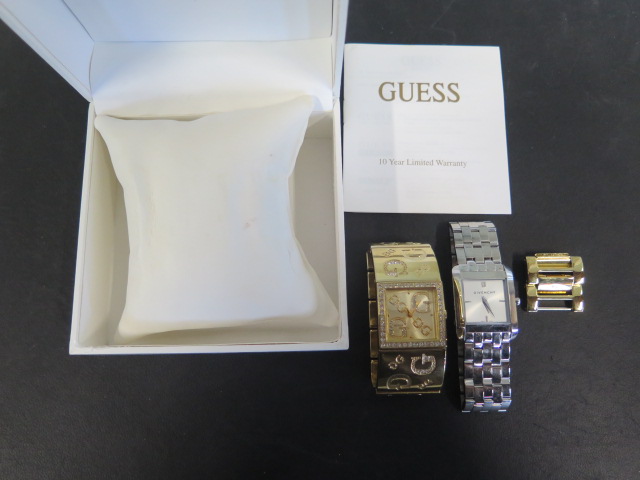 A ladies Guess gold tone and rhinestone wristwatch and a steel Givanchy wristwatch, require