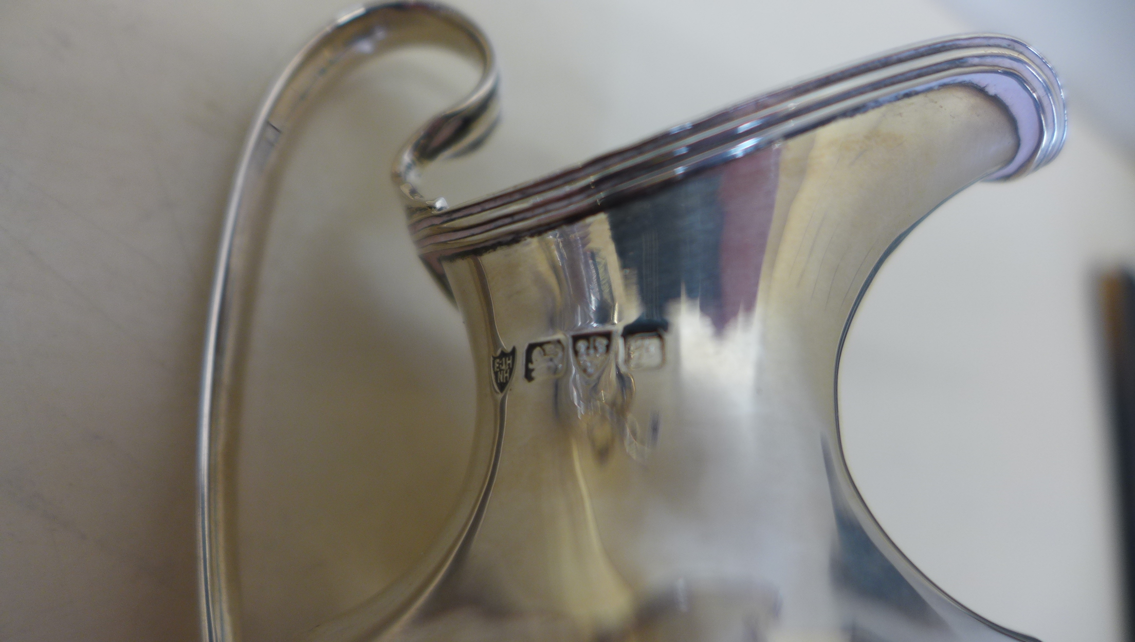 A silver twin handled sugar bowl, Birmingham 1902 - a silver cream jug Chester 1906 - and a silver - Image 5 of 5