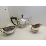 A Harlequin silver three piece tea service, various makers and dates but same design, weight