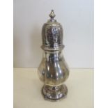 A silver shaker, 22cm tall, London 1911/12 - maker GH, approx 9.6 troy oz, minor bending to knop