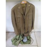 An army Dental Corps captains uniform to include No2 jacket, trousers and peak cap, two canvas bags,