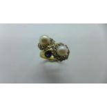 An unmarked yellow gold pearl ring, size O, approx 7 grams, generally good, tests to approx 18ct