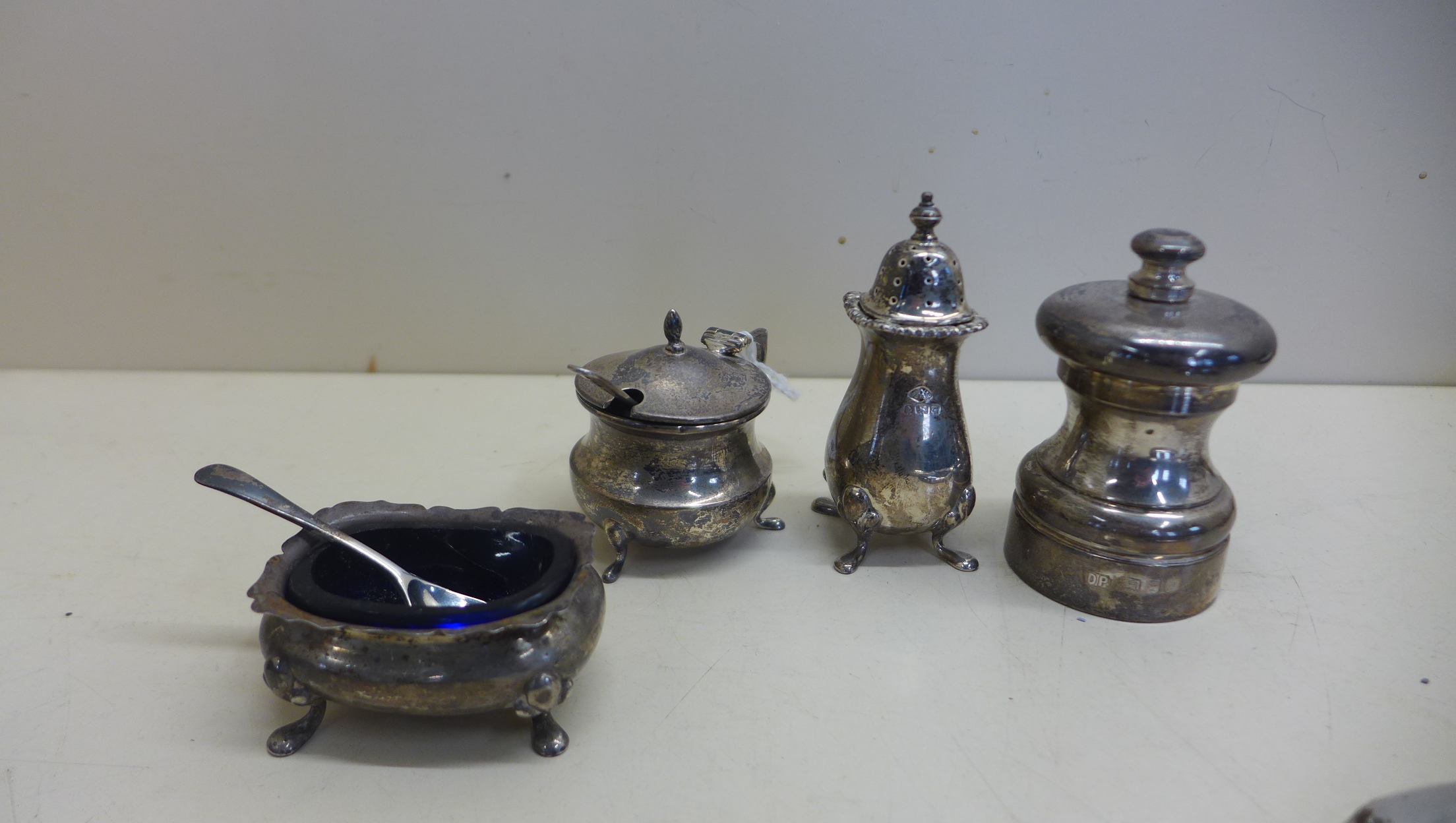 Four silver cruet pieces including a Peter Piper pepper London maker DP, the other pieces Birmingham