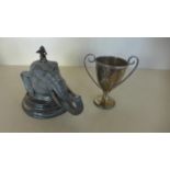 A silver plated desk inkwell in a the form of an elephants had with a monkey playing a pipe, 14cm