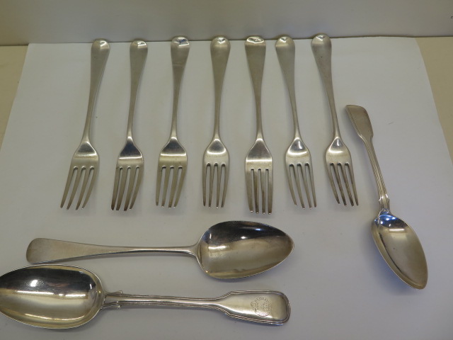 A quantity of Georgian silver flatware comprising of seven table forks, tablespoon and dessert