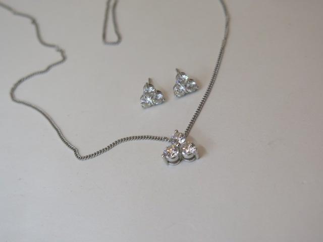 An 18ct white gold three stone diamond pendant on chain, total diamonds approx 1ct with matching - Image 2 of 3