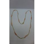 An 18ct gold and coral bead necklace, weight approx 9.8 grams, length 71cm - clean condition, with