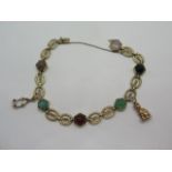 A pretty 14ct gold fancy link and gem stone bracelet set with moonstone, carnelian, quartz,