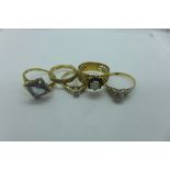 Five 9ct rings including a diamond solitaire, approx 0.10ct - total weight approx 12.4 grams
