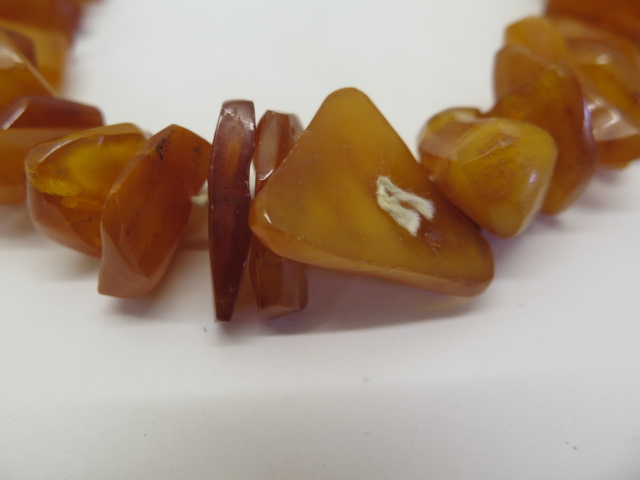 Two strings of deep honey colour un-cut polished amber beads, total weight approx 168 grams, lengths - Image 2 of 4