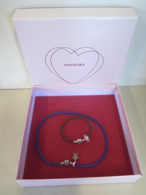 A Pandora silver and leather bracelet and necklace