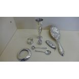 A small collection of silver items including vase, napkin ring, brush etc, weighable silver approx