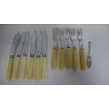 A part silver bladed fish set with silver ended forks, eleven pieces and a small silver knife, total