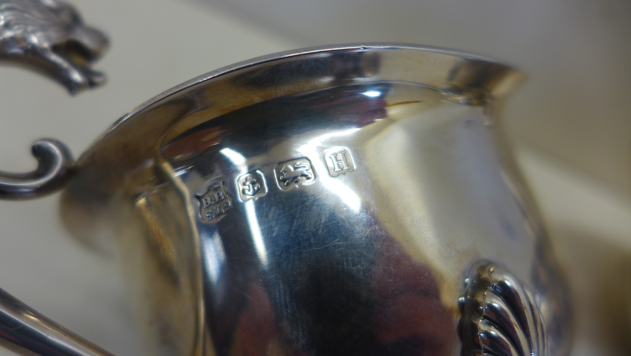 A silver twin handled sugar bowl, Birmingham 1902 - a silver cream jug Chester 1906 - and a silver - Image 4 of 5