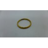 A 22ct yellow gold hallmarked band ring, approx 2.2 grams