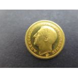 A 1932 gold Yugolavian 1 Dukat coin, portrait of Alexander I facing left on reverse, double eagle