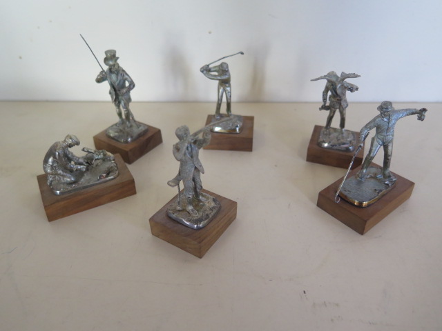 Six silver models each a character of different form including the golfer, the poacher, the