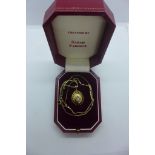 A Sarah Faberge 9ct gold egg pendant on a 9ct chain, with a pearl inside the pendant, limited no 343