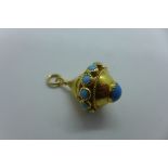 An 18ct yellow gold turquoise pendant, 3.5cm tall, approx 8.5 grams