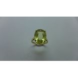 A hallmarked 9ct golden sapphire solitaire ring, size P, the stone measures approx 15.5mm x 12mm x