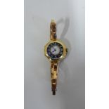 A 9ct yellow gold Rolex, manual wind ladies wristwatch, the dial signed Asprey, case 23mm wide, on a