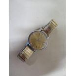 A vintage Omega Geneve automatic gents wristwatch with date, 34mm case on a sprung strap, some usage